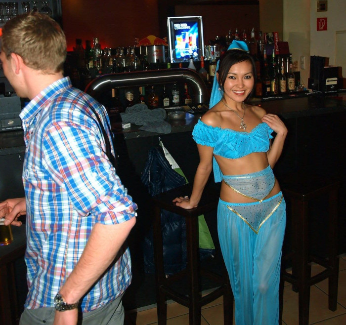 Sexy mongolian is undressing at public bar