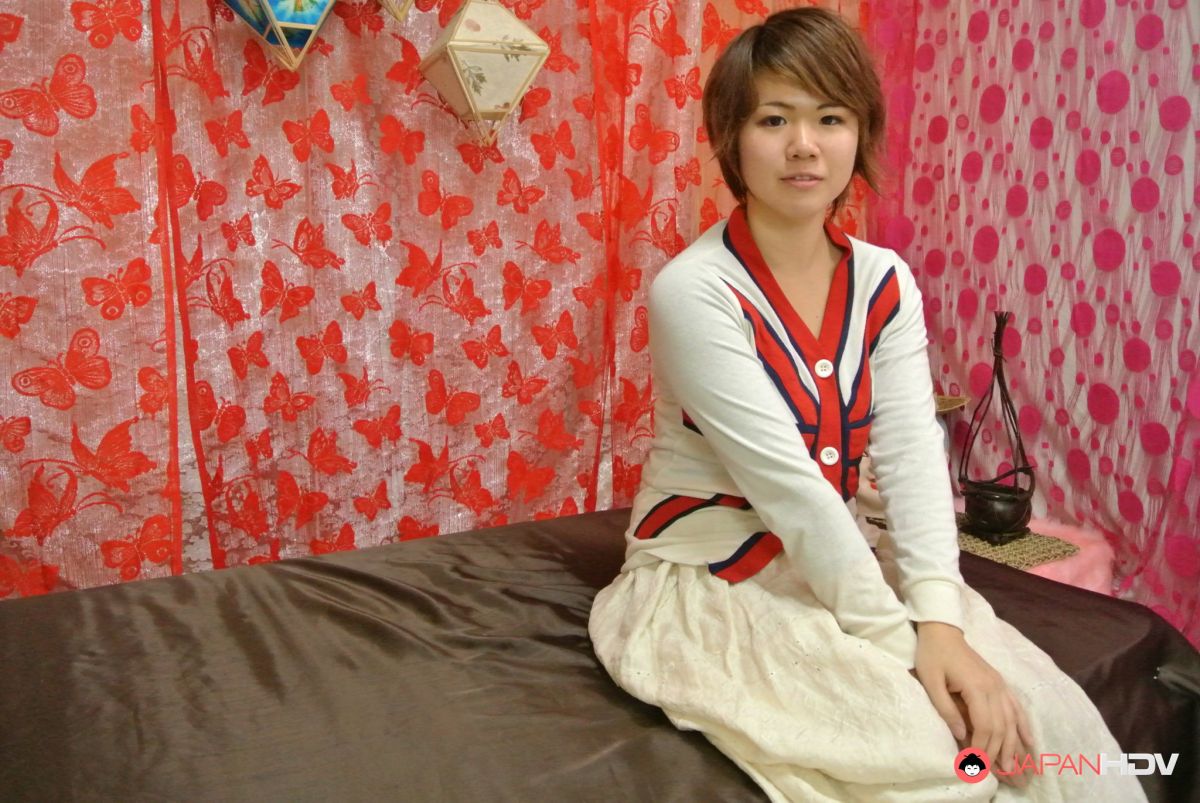 Cute Rei Senzaka spreads her hairy pussy to show her holes