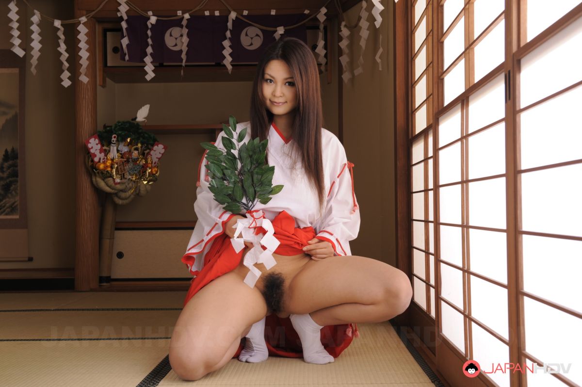 Sexy Airi Ai shows hairy pussy under short kimono for pictures.