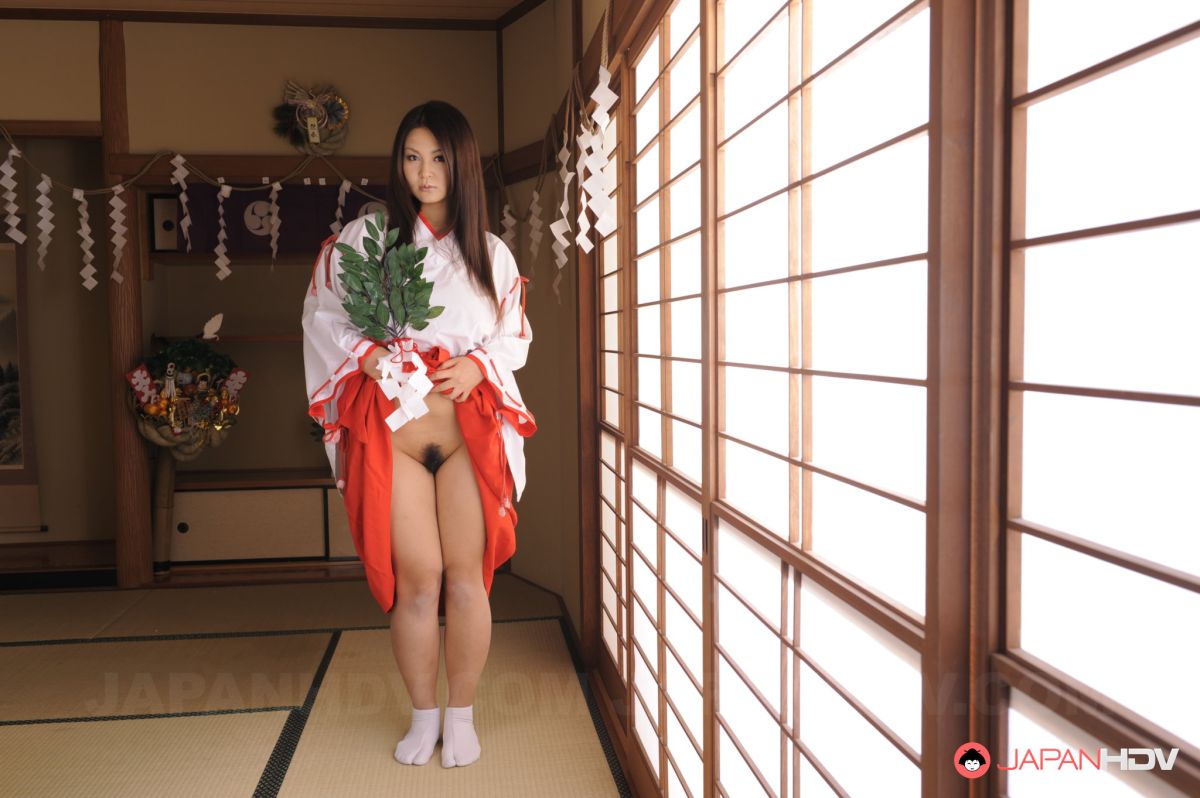 Sexy Airi Ai shows hairy pussy under short kimono for pictures.